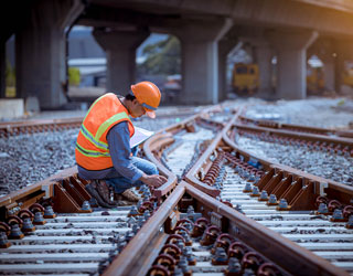 Engineer sitting on train track in split